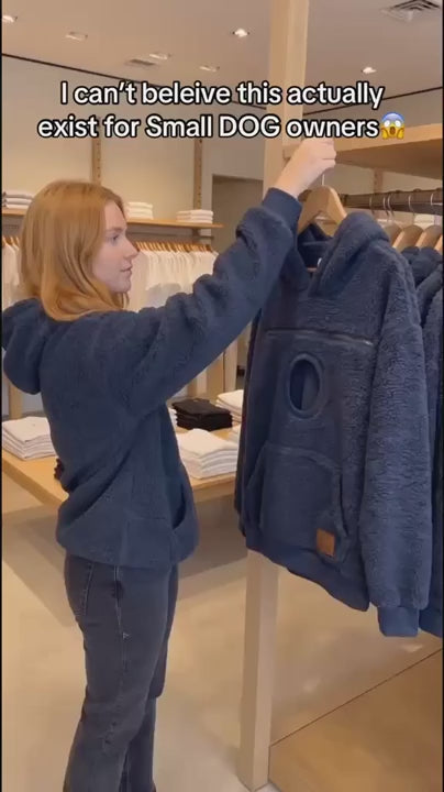Customer finding the pet carrier hoodie in a store